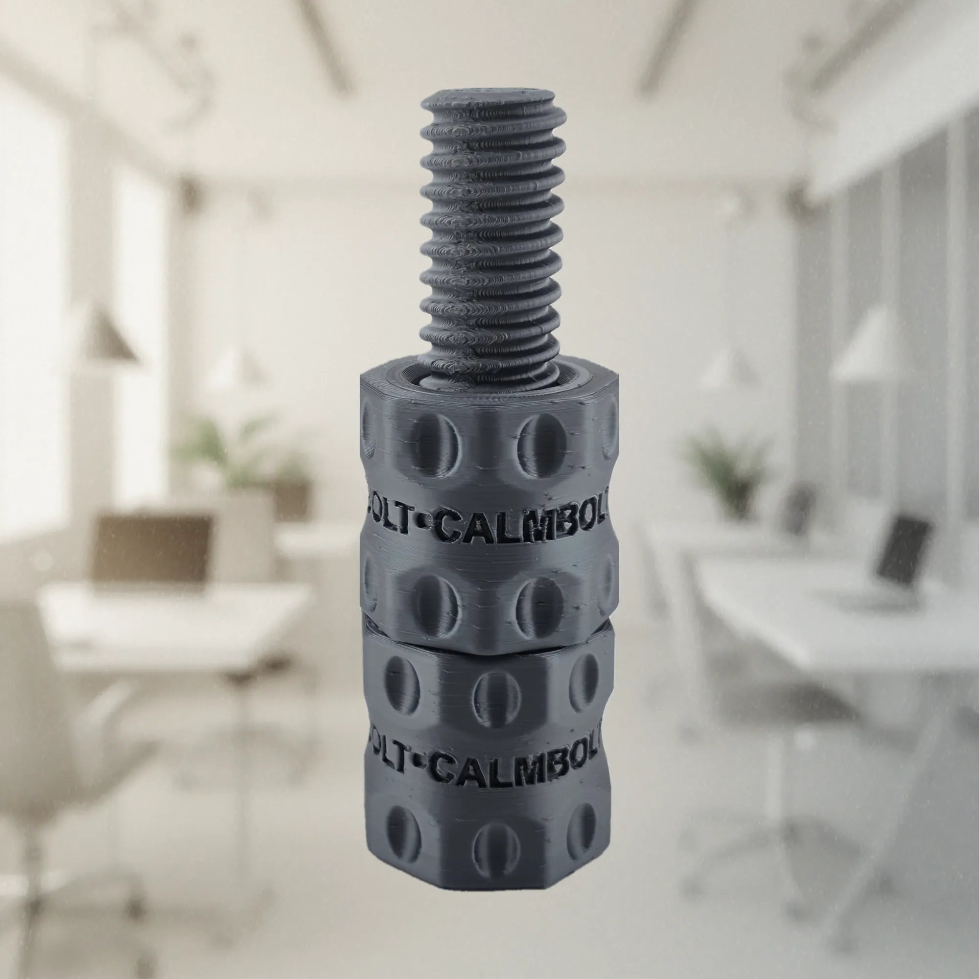 CalmBolt Graphite tactile fidget with dark metallic-inspired finish and rotating threaded structure