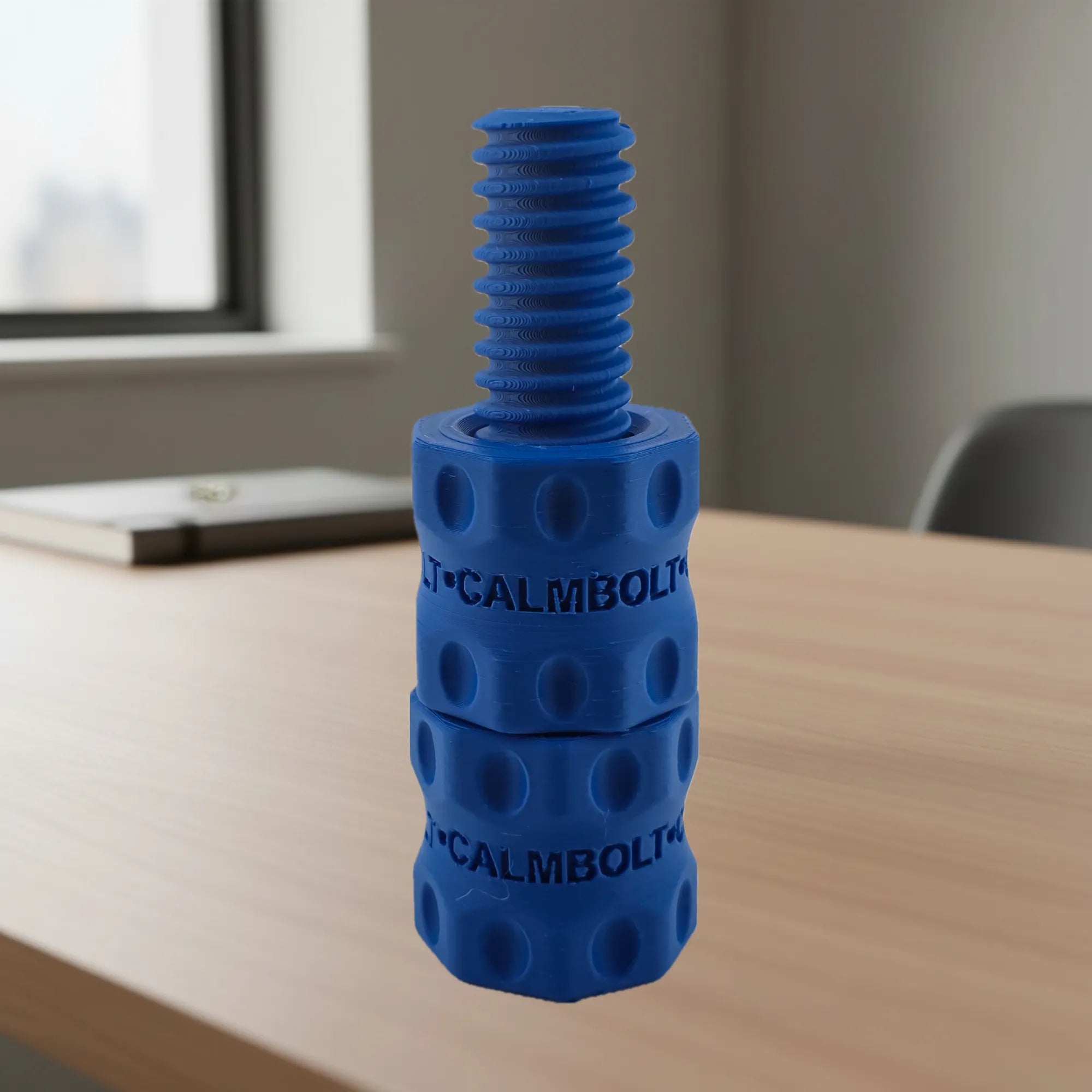 CalmBolt Indigo tactile fidget with deep blue finish and smooth threaded rotation