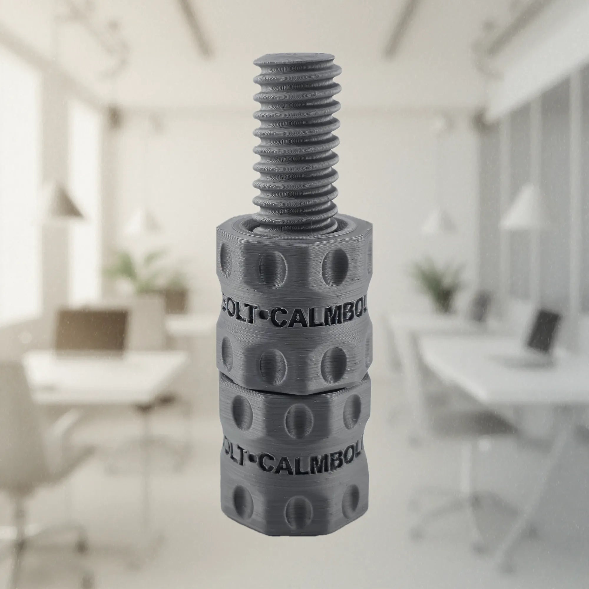 CalmBolt Mist Silver rotating desk fidget with soft metallic tones and layered spiral texture