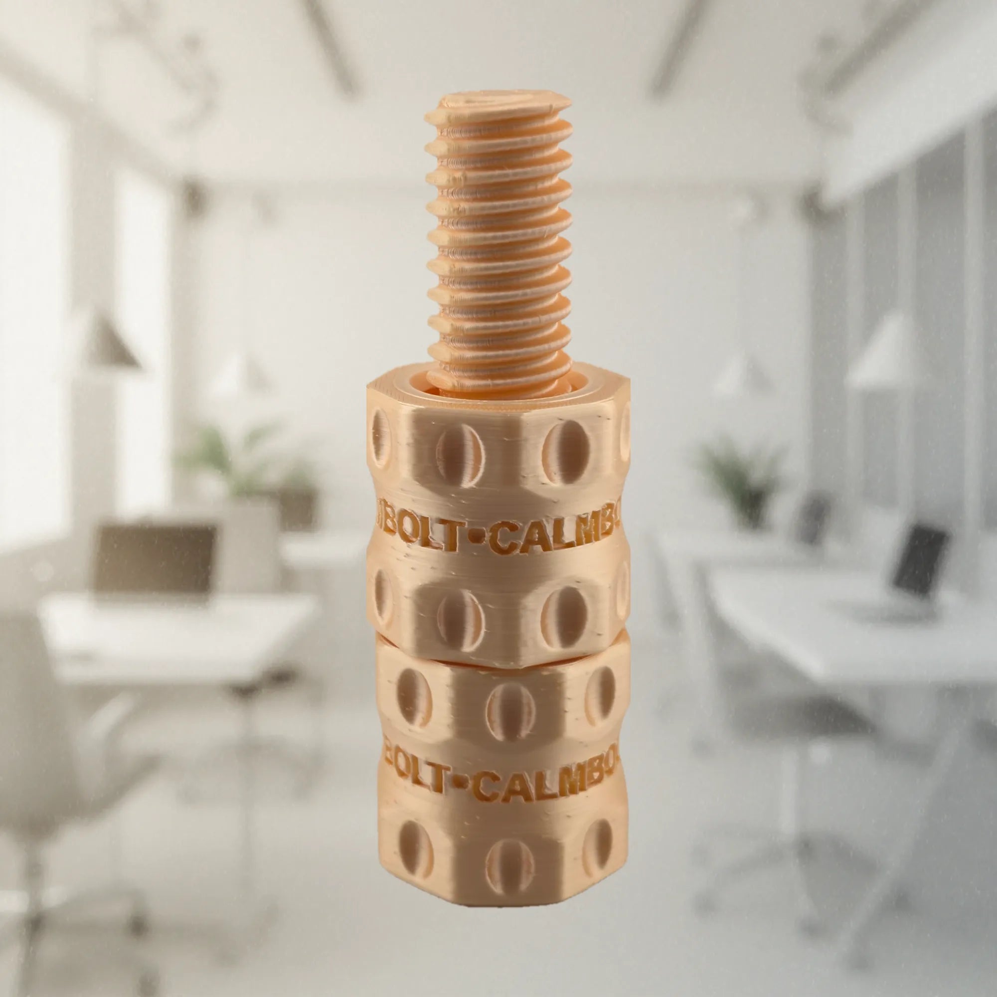 CalmBolt Rose Glow tactile fidget with warm reflective finish and sculpted rotating form